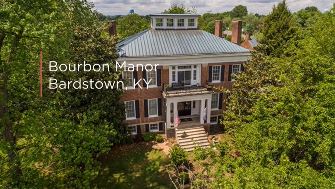 words bourbon manor Bardstown, and house of bricks among trees