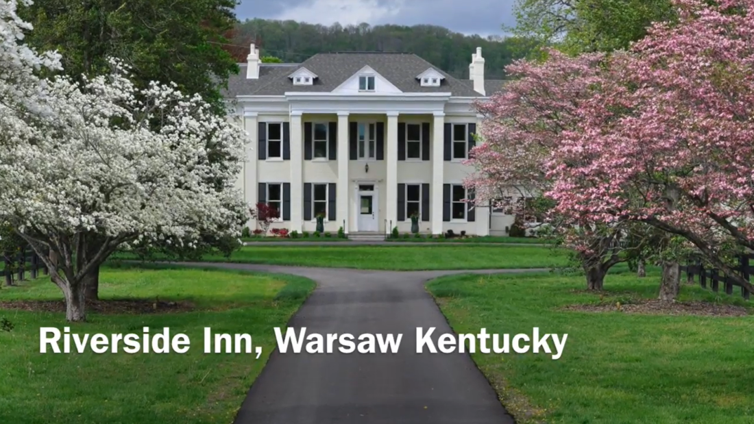 riverside inn bed and breakfast and trees on both sides of the road