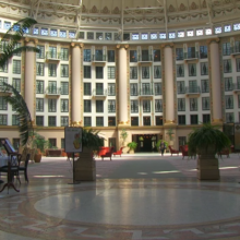 West Baden Springs Hotel with flowers, tables, and chairs in it