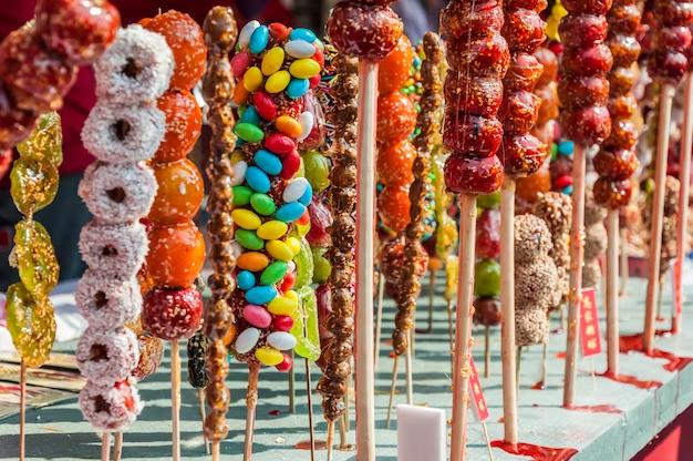 An image of colorful candies on sticks arranged together