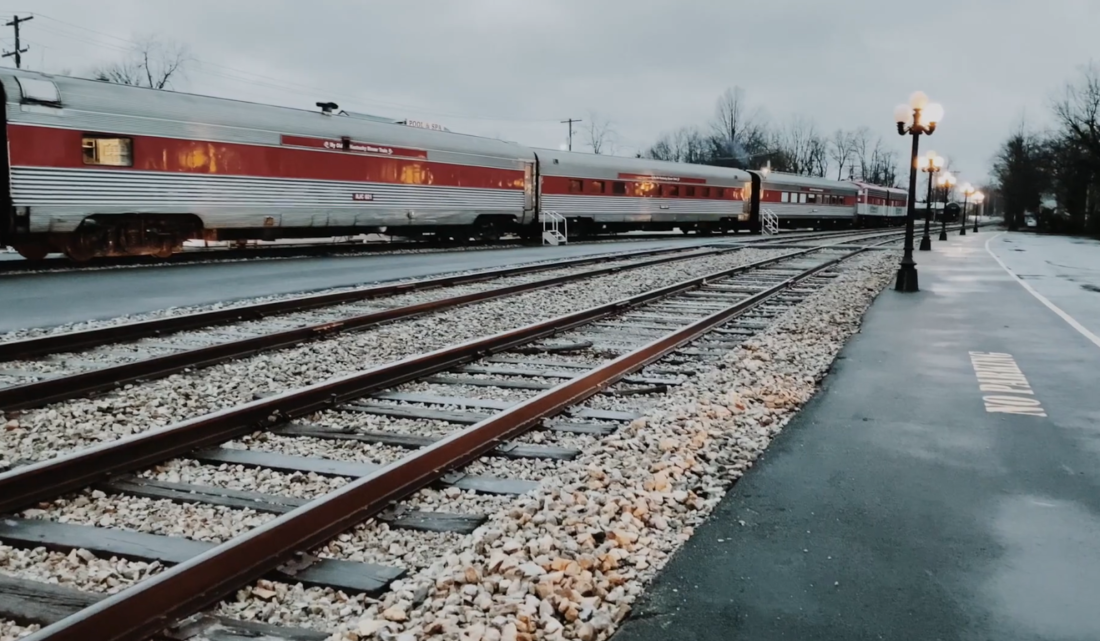 train and the railroads and street lights on the right side
